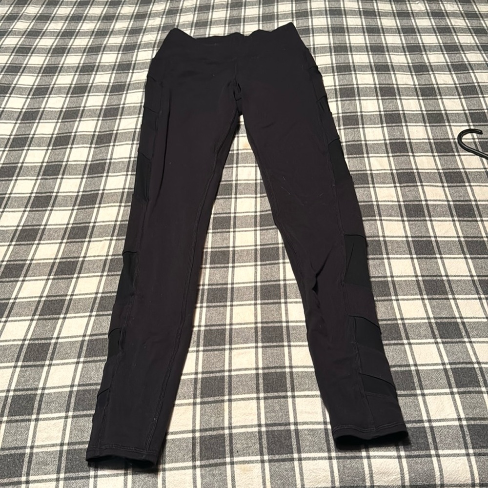 Size small black alo leggings with mesh up to he sides